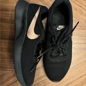 Nike sneakers, black and bronze, size 8.